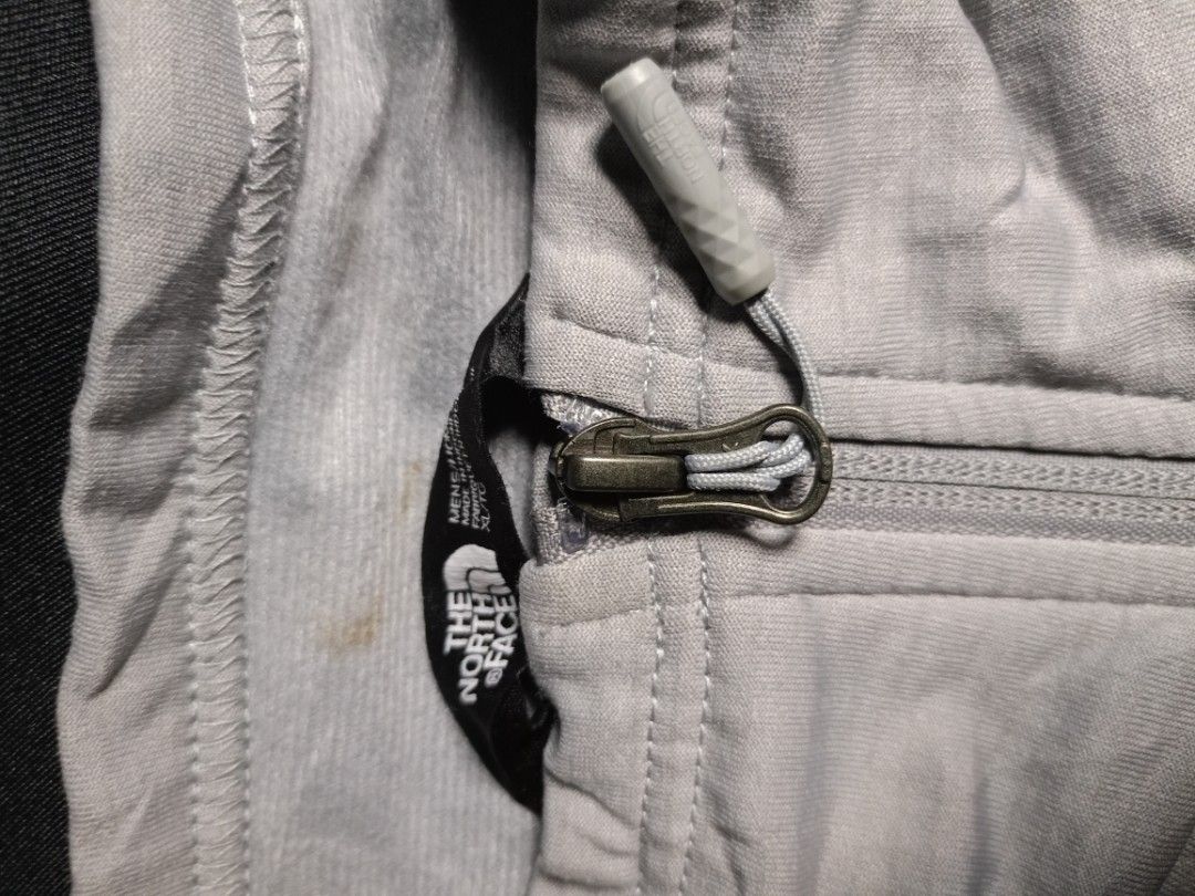 The North Face Men's 1/4 Zip Grid Fleece Pullover (Light Grey) (Category: Coats, Jackets and Outerwear) located in Dinalupihan. Submitted by ronthrifthings (Listing ID 1463146996, Image 2). Description: Authentic The North Face (TNF) 1/4 Zip Technical Pullover *Color: Light Heather Grey with an embroidered black TNF logo on the left chest and back right shoulder. *Material: High-performance grid fleece lining (waffle matrix pattern), ultra-breath