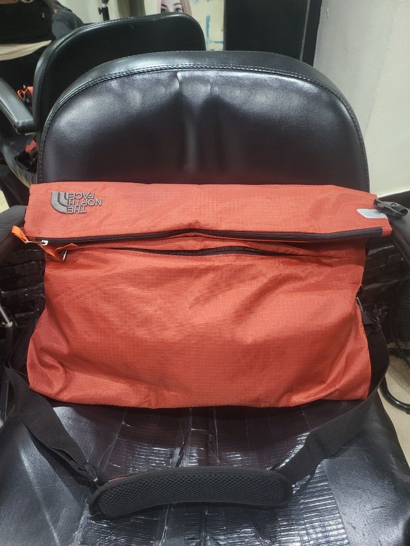 The North Face Orange Sling Bag (Category: Sling Bags) located in Manila. Submitted by milkymitch23 (Listing ID 1463301171, Image 1). Description: - Orange The North Face sling bag - Main zippered compartment with YKK zipper - Ideal for everyday use or travel - Made from lightweight and durable material - Easy to pack and carry.