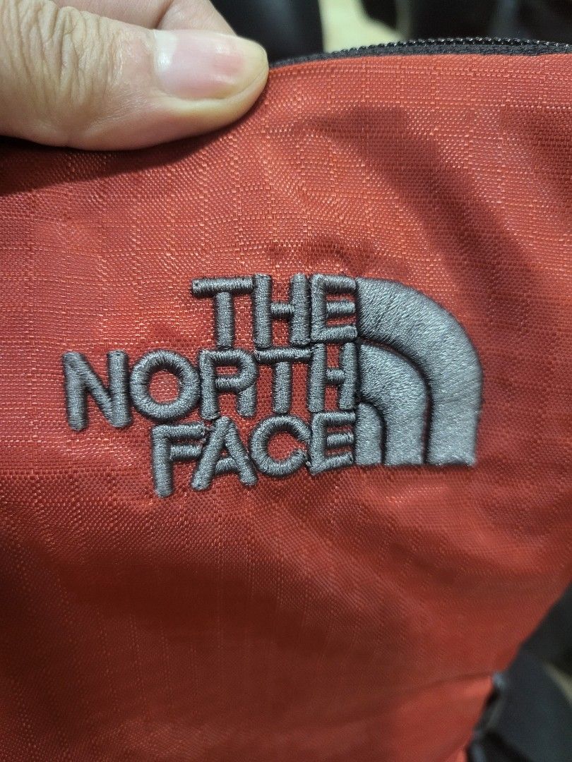 The North Face Orange Sling Bag (Category: Sling Bags) located in Manila. Submitted by milkymitch23 (Listing ID 1463301171, Image 3). Description: - Orange The North Face sling bag - Main zippered compartment with YKK zipper - Ideal for everyday use or travel - Made from lightweight and durable material - Easy to pack and carry.