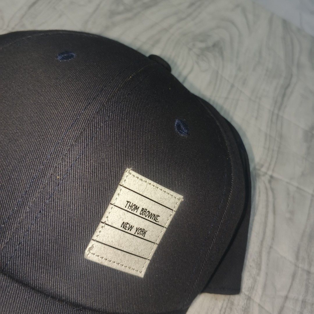 Thom Browne Cap navy blue (Category: Caps & Hats) located in Manila. Submitted by janna_m (Listing ID 1463301897, Image 2). Description: EXCELLENT CONDITION ✅ NO ISSUES ✅ DM FOR INQUIRIES 📩.
