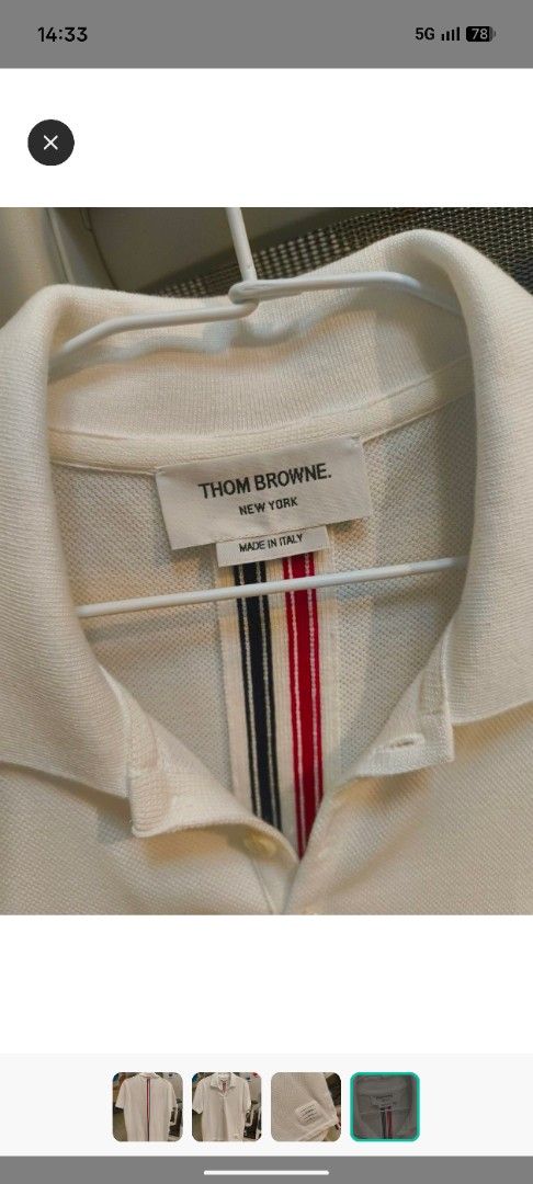 Thom Browne White Polo Shirt Size 0 (Category: Tshirts & Polo Shirts ) located in Makati City. Submitted by truepenguin.4e0812 (Listing ID 1463177543, Image 3). Description: - Authentic Thom Browne white polo shirt - Size 0 - Signature tricolor stripe detail on placket and hem - Made in Italy - Textured fabric - Button closure at the neck.