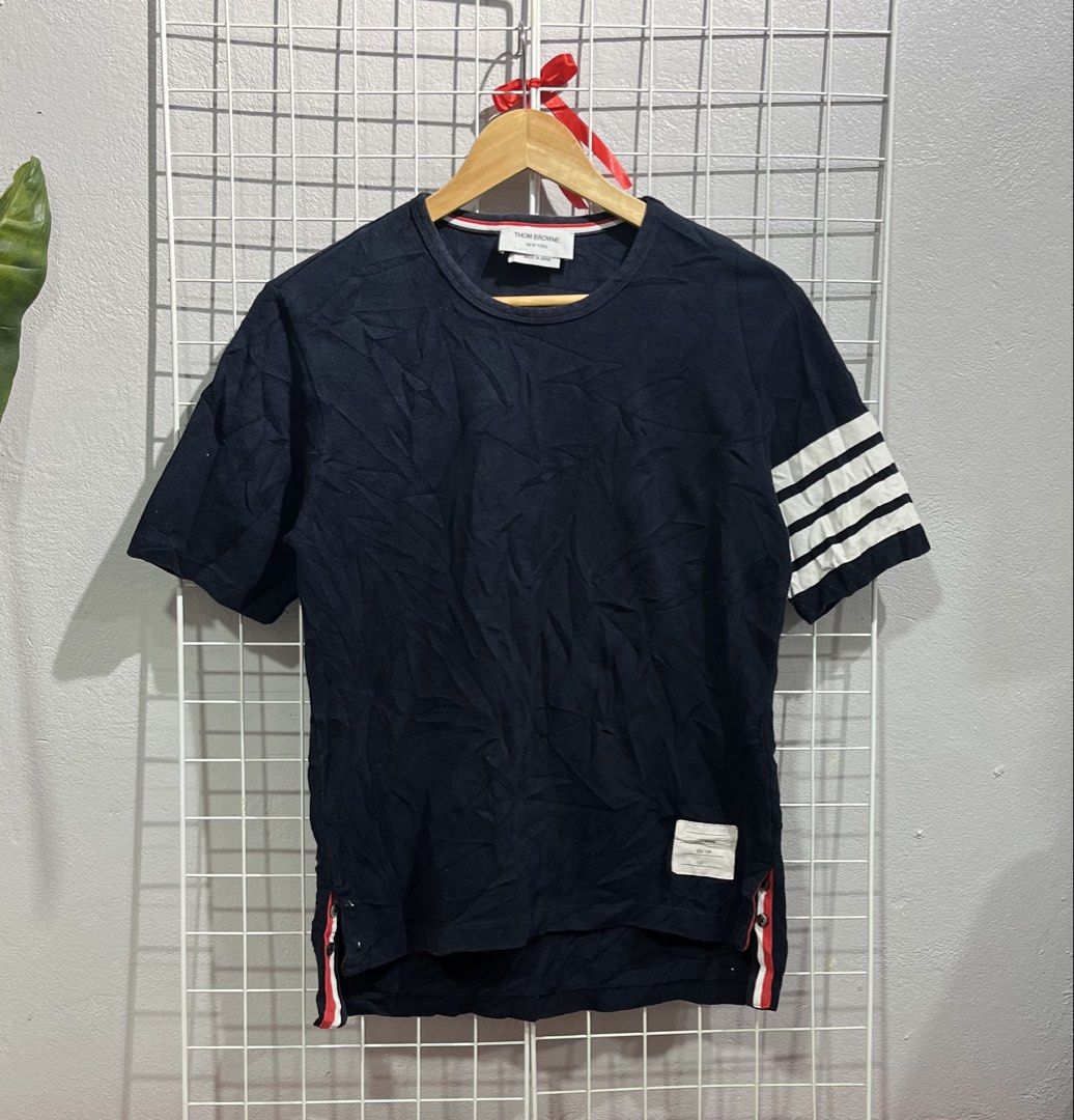 Thom Browne New York Crew Neck Tee (Category: Luxury Apparel) located in Tuguegarao City. Submitted by preowned_curation (Listing ID 1463128669, Image 1). Description: 4 Bar Sleeve Stripe Size 1 (Front length: 24, Back Length: 26 x 18.5) Minor dirt Color rate 9.5/10 Needs lightwash only 750 + SF.