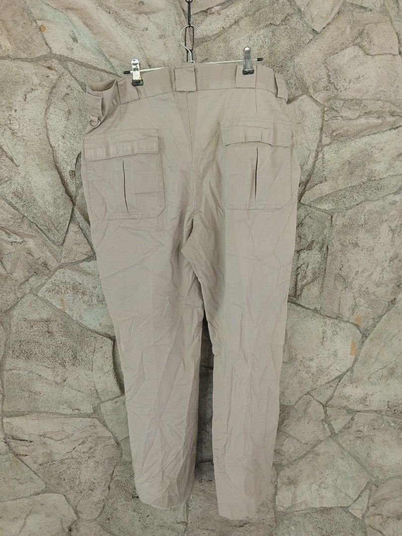 Tilley Endurables Khaki Cargo Pants (Category: Chinos) located in Orani. Submitted by thriftniea (Listing ID 1463202967, Image 2). Description: W36 L41 H9 - Brand: Tilley Endurables - Style: Khaki Cargo Pants - Features: Numerous pockets for ample storage - Condition: Some fraying on the hem (see last photo) - Recommended Use: Outdoor adventures, casual wear - Care Instructions: 'GIVE 'EM HELL!' (suggests durability).