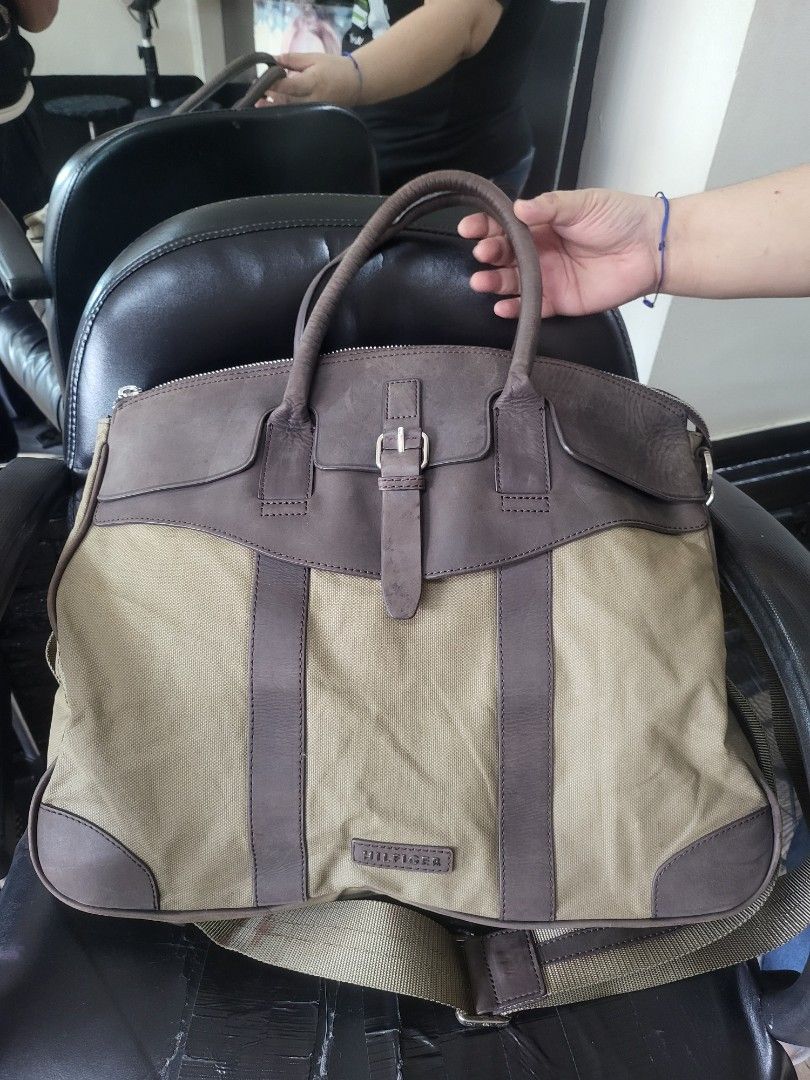 Tommy Hilfiger Canvas & Leather Messenger Bag (Category: Sling Bags) located in Manila. Submitted by milkymitch23 (Listing ID 1463301928, Image 1). Description: - Authentic Tommy Hilfiger messenger bag - Khaki canvas with brown leather accents - Adjustable shoulder strap for comfort - Secure zip closure for the main compartment - Multiple interior pockets for organization - Interior zip pocket for valuables - Ideal for everyday use or travel - No