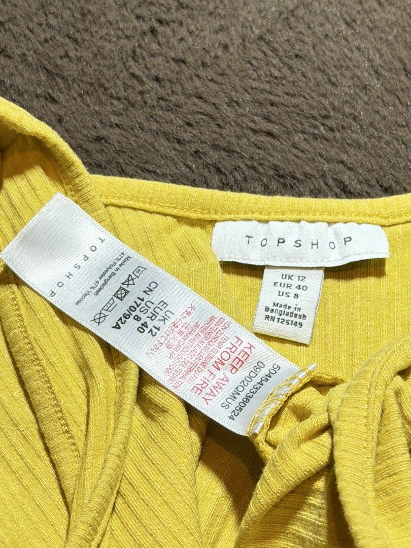 TOPSHOP yellow button ribbed tank top (Category: Sleeveless) located in Valenzuela. Submitted by julijulyxoxo (Listing ID 1463326499, Image 3). Description: where to find me: Facebook: Julianne Leigh (post is already up) Instagram: shop.loveandrelove (might post updates/items here too) MOP: maribank, gcash, maya MOD: J&T Express Item is unwashed. Please wash immediately before wearing!.