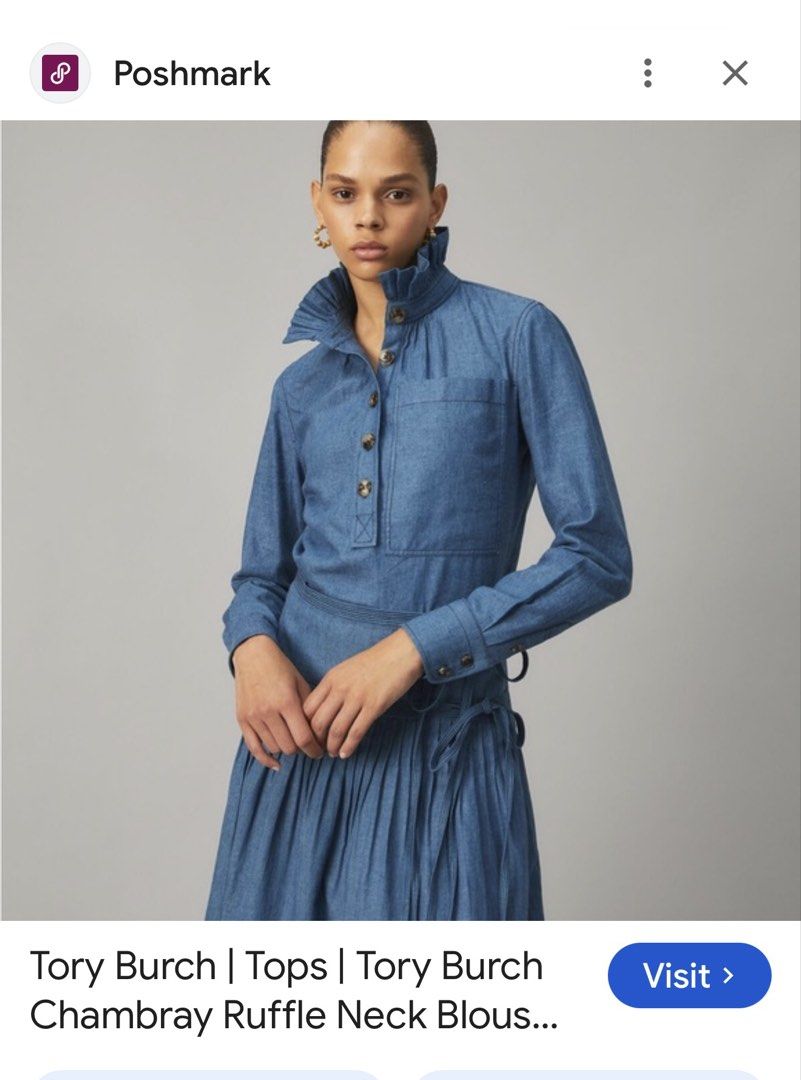 Tory Burch Chambray Ruffle Neck Blouse (Category: Blouses) located in Santiago. Submitted by yrellagnoihsaf (Listing ID 1463142371, Image 2). Description: - Brand: Tory Burch - Color: Blue Chambray - Size: 4 - Features: Ruffled high neck, button-up front, long sleeves with button cuffs, chest pocket - Origin: Made in China.