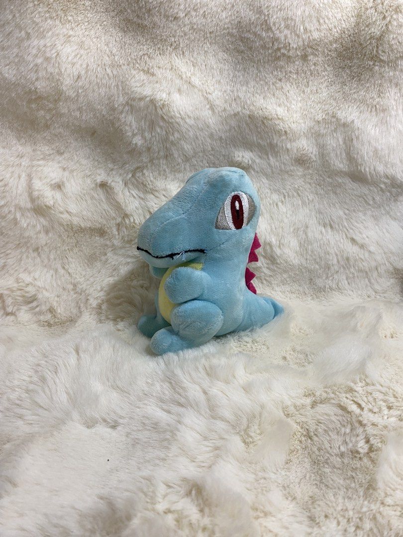 Totodile Pokemon Plush Charm Keychain (Category: Plushies & Soft Toys) located in Kalibo. Submitted by ollie_stuffshop (Listing ID 1463171263, Image 2). Description: Before you send your inquiries: ❗️Last Price is already posted ❗️Manage your expectations, WYSIWYG ❗️May need washing ❗️Dropoff is every Wednesday & Sunday - Adorable blue dinosaur plush toy - Resembles a Pokemon character - Super soft and cuddly - Approximately 6 inches tall - Ideal