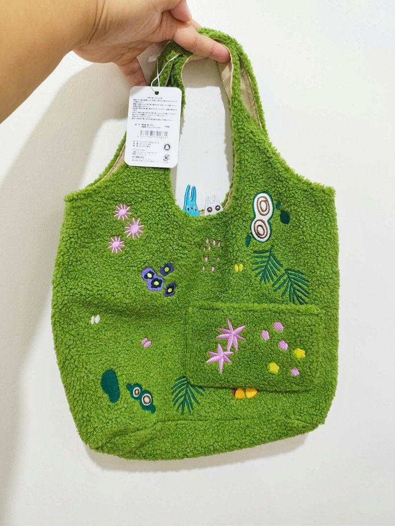 Totoro Ghibli shoulder bag (Category: Shoulder Bags) located in Manila. Submitted by creeppycreeps (Listing ID 1463170312, Image 1). Description: Totoro moss green shoulder bag 🌿 20x16" Studio Ghibli etiketa with papertag Embroidered details✨Brand new.