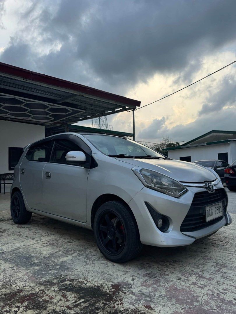 Toyota Wigo (Category: Used Cars) located in Quezon City. Submitted by altheafrnchz (Listing ID 1463316653, Image 2). Description: Toyota Wigo G 2018 — Important Details * Price: ₱375,000 cash * Financing: ₱100,000 all-in down payment * Transmission: Automatic * Mileage: Low mileage * Ownership: First owner acquired * Condition: Well-maintained interior & exterior * Modifications: Full exhaust system, RAYS Thai-copy wheels, blue tint * Use: Econo