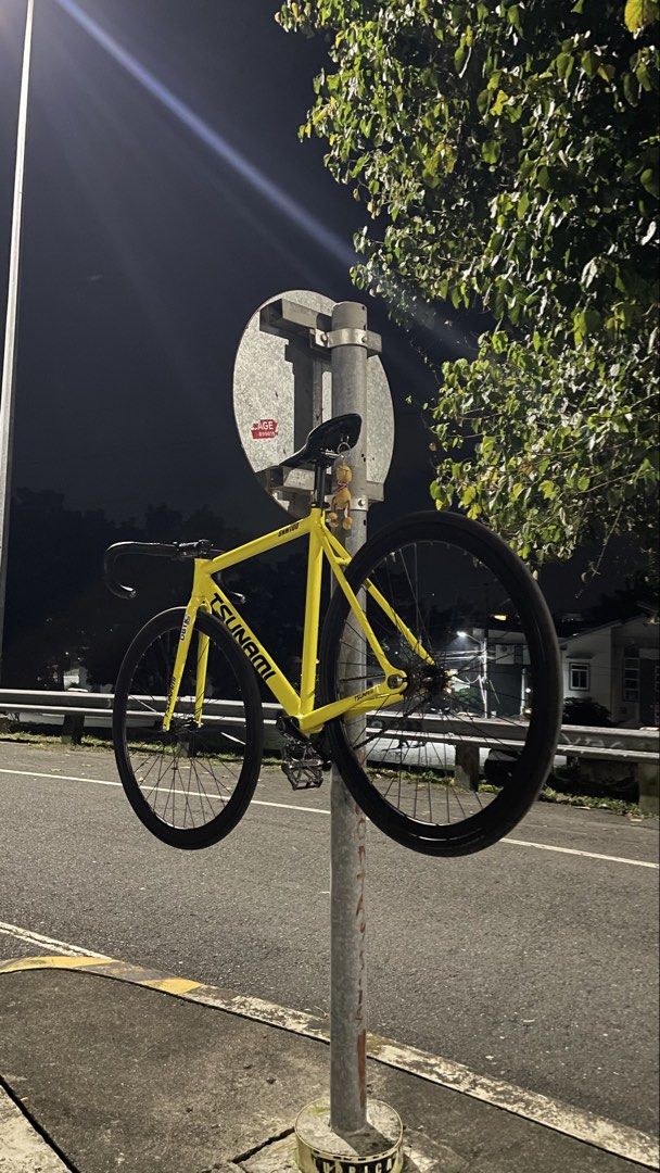 Tsunami Yellow Fixed Gear Bicycle (Category: Bicycles) located in Manila. Submitted by akosiseannagbebenta (Listing ID 1463214677, Image 1). Description: - Yellow Tsunami fixed gear bike - Single speed, ready to ride - Perfect for city commuting or cruising - Minor scuffs on frame from normal use - Small toy attached to seat post.