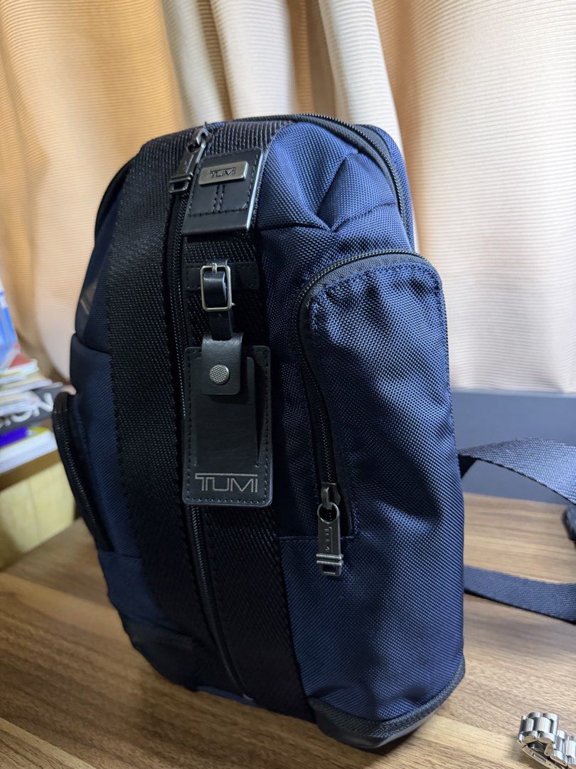 Tumi Higgins Sling (Category: Luxury Bags & Wallets) located in Quezon City. Submitted by nicoandjujie (Listing ID 1463183890, Image 2). Description: Up for sale is an authentic Tumi Higgins Sling in a Navy Blue tone. Lightly used in excellent condition. Clean interior and exterior; zippers and hardware function smoothly. Reason for selling: Bought this thinking it would fit like a lightweight sling, but it’s a bit too big for my setup. Price is 