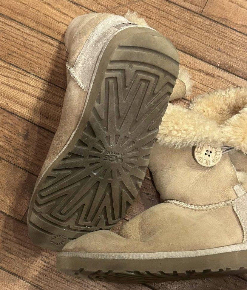 UGG Australia Bailey Button Boots (Category: Boots) located in Baguio. Submitted by workwear2600 (Listing ID 1463203186, Image 2). Description: - Classic UGG Bailey Button boots - Color: Tan/Beige - Size: Women's 5 (W5) - Features warm sheepskin lining for ultimate comfort - Signature UGG Australia sole - Convenient side button closure - Ideal for everyday casual wear.