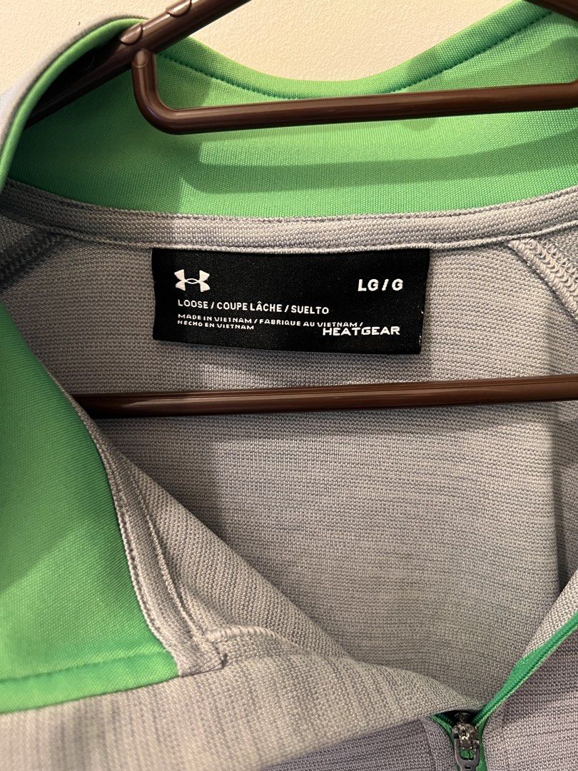 Under Armour Zip Long Sleeve Shirt (Category: Tshirts & Polo Shirts ) located in Las Pinas. Submitted by basicapparel_mnl (Listing ID 1463199178, Image 3). Description: - Grey Under Armour long-sleeved shirt - Features a green collar and zipper - Made with HeatGear material - Size: LG - Ideal for sports or casual wear.