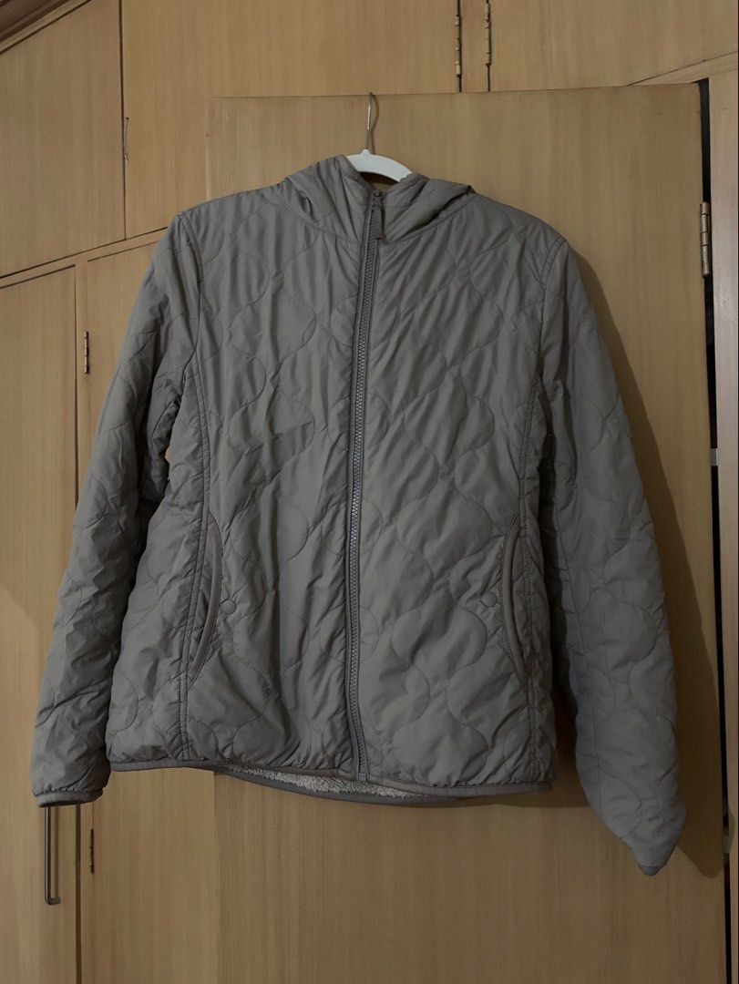 Uniqlo Quilted Hooded Jacket Size M (Category: Coats, Jackets and Outerwear) located in Baguio. Submitted by tresmariascloset13 (Listing ID 1463226922, Image 1). Description: - Uniqlo Grey Quilted Jacket - Size: Medium (M) - Soft, fuzzy lining for ultimate warmth - Hooded design - Ideal for cooler weather .