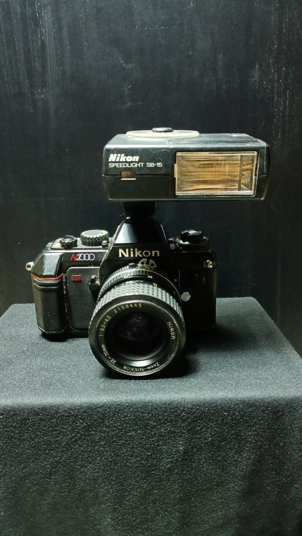 UNTESTED Nikon N2000 (Category: Cameras) located in Caloocan City. Submitted by rectooangelo (Listing ID 1463140361, Image 2). Description: 📷Nikon N2000 (No battery and film) ✅Lens: NIKON AF NIKKOR 35-70mm F3.3 / 4.5 Zoom Lens From Japan ✅Nikon Speedlight SB-15 Shoe Mount Flash for Nikon ₱2,000.