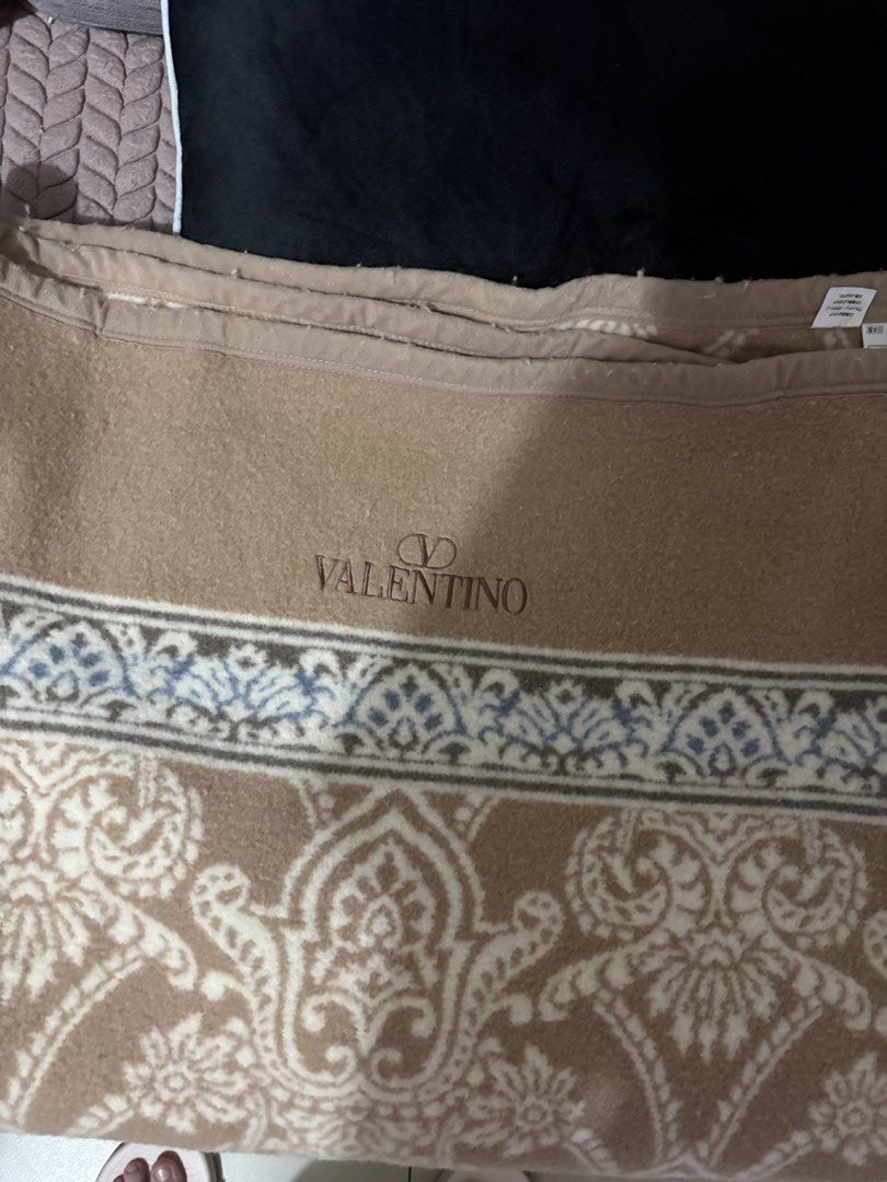 Valentino Maison Wool Blanket 140x200cm (Category: Bedding & Towels) located in Quezon City. Submitted by bluefrenchorn (Listing ID 1463173910, Image 1). Description: - Valentino Maison Blanket - Made in Japan - Material: 95% Wool, 5% Cashmere - Size: 140cm x 200cm - Features a beautiful pattern - Ideal for keeping warm.
