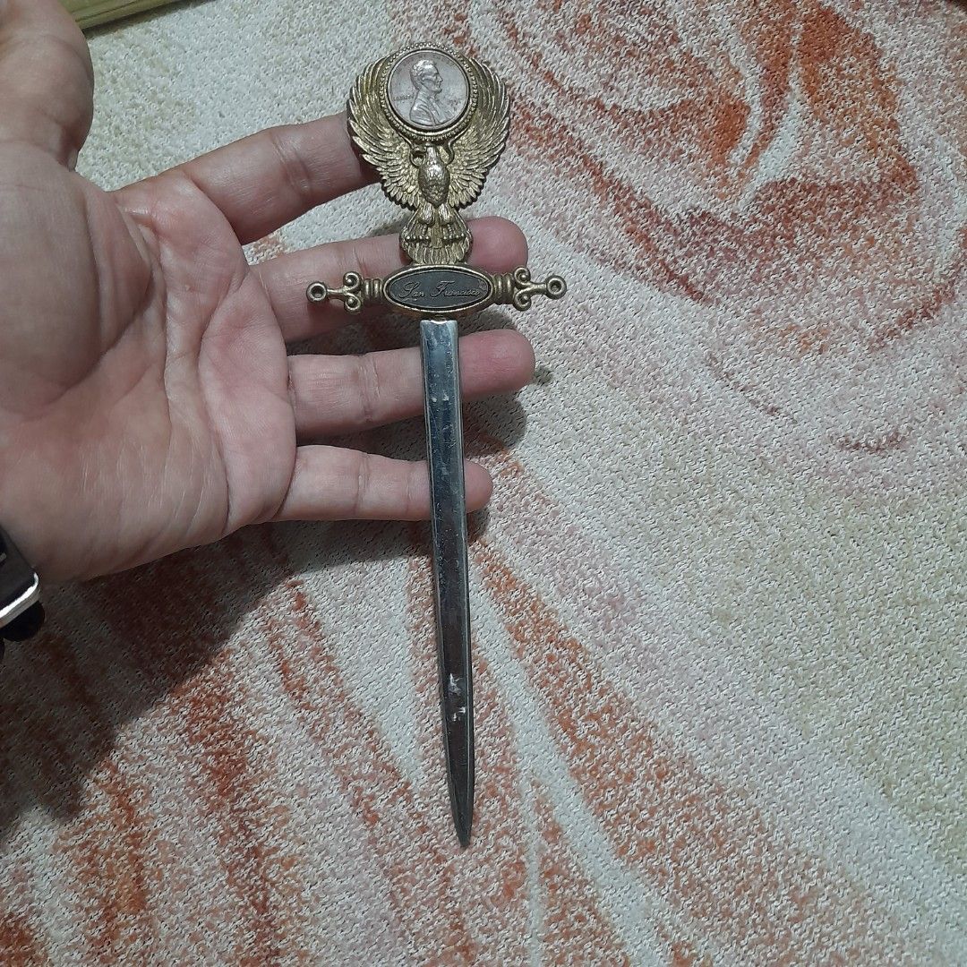 Vintage Letter Opener (Category: Vintage Collectibles) located in Bocaue. Submitted by marajapansurplus (Listing ID 1463243784, Image 1). Description: - Vintage letter opener with detailed eagle design on handle. - Features an inset coin on the handle. - 'San Francisco' is inscribed on the handle. - Blade is stainless steel and marked. - Perfect for desk decor or a collector's item. - Shows some signs of age, adding to its vintage charm..