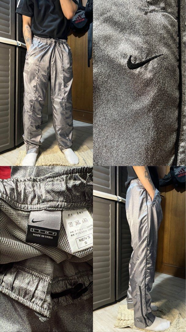 Vintage Nike Silver Track Pants (Category: Joggers) located in Angono. Submitted by odd.fitt (Listing ID 1463298284, Image 1). Description: Small 28-40W 40L 7H Ankle zip.