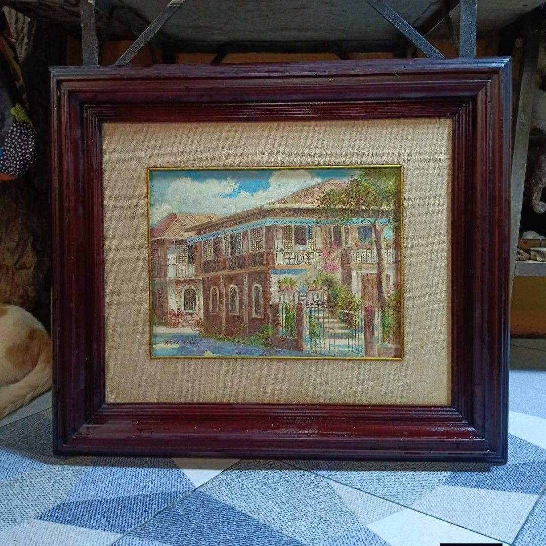 Vintage Painting by AP Corpus (Category: Everything Else Others) located in Mandaluyong City. Submitted by theforgottentreasures (Listing ID 1463250088, Image 1). Description: 12k pesos! 📌 1989 Painting by: AP Corpus This framed artwork appears to be a vintage oil on canvas painting of a traditional Filipino bahay na bato (colonial-era ancestral house) signed and dated by the artist A.P. Corpuz in 1985, showcasing classic architectural elements 