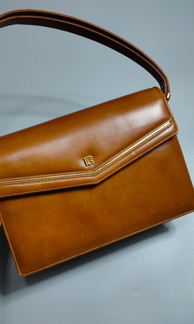 Vintage Pierre Balmain Brown Bag (Category: Luxury Bags & Wallets) located in Bolinao. Submitted by tokiya. (Listing ID 1463172563, Image 3). Description: Vintage Pierre Balmain Pwede kili bag, pwede sling bag Size: 10inches width, 7inches length May mga scratches restore niyo nalang.