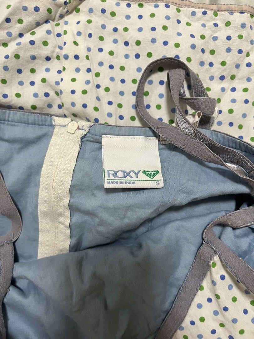 Vintage Roxy Polka Dot Mini Dress with Adjustable Straps (Category: Dresses) located in Makati City. Submitted by diannecheryl (Listing ID 1463178895, Image 2). Description: - Cute white mini dress - Straps are stretched out! Otherwise no flaws - Blue and green polka dot pattern - Roxy brand - Size S - Adjustable grey straps - Zipper closure at the back - Ideal for casual wear or lounging.