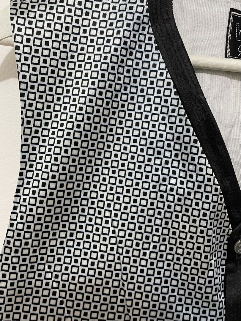 Vintage Versus Gianni Versace Vest (Category: Luxury Apparel) located in Santa Rosa. Submitted by saksthriftavenue (Listing ID 1463227094, Image 3). Description: 90s Versus Gianni Versace vest, featuring optical geometric pattern. Black trim, button details, and adjustable back strap. Made in Italy. Armpit to armpit: 20 inches Length: 23 inches .