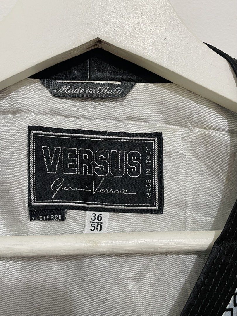 Vintage Versus Gianni Versace Vest (Category: Luxury Apparel) located in Santa Rosa. Submitted by saksthriftavenue (Listing ID 1463227094, Image 2). Description: 90s Versus Gianni Versace vest, featuring optical geometric pattern. Black trim, button details, and adjustable back strap. Made in Italy. Armpit to armpit: 20 inches Length: 23 inches .