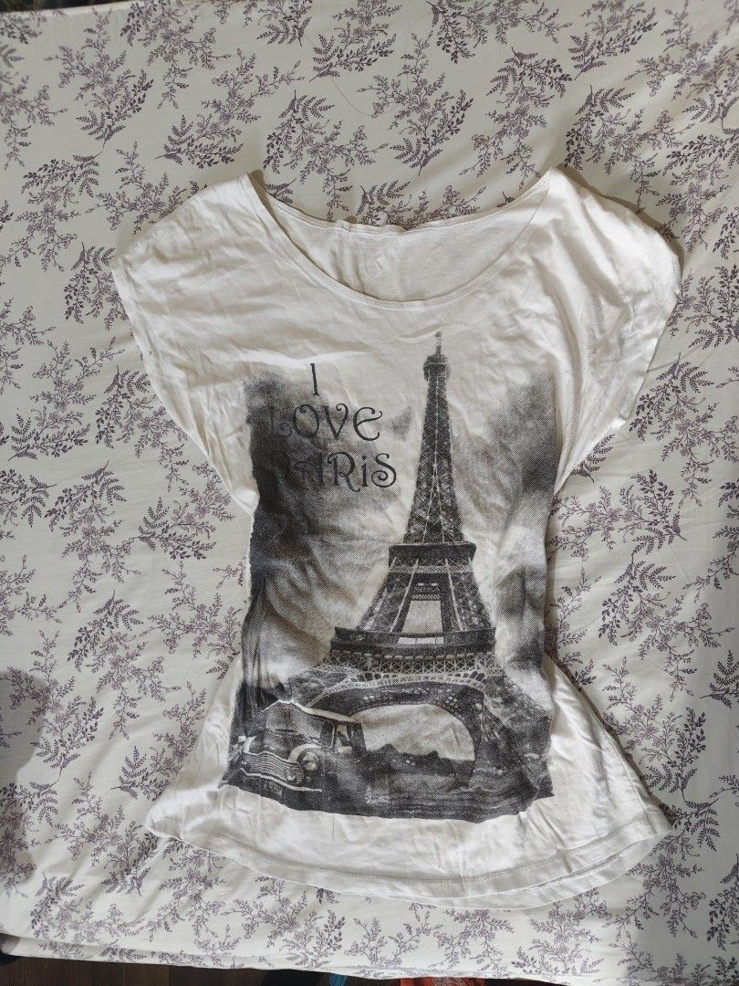 vintage Y2K white paris cotton tee (Category: Shirts) located in Bulacan. Submitted by angel.decluttersx (Listing ID 1463187033, Image 1). Description: large size ww provided cotton fabric material no issue 26" in Length.