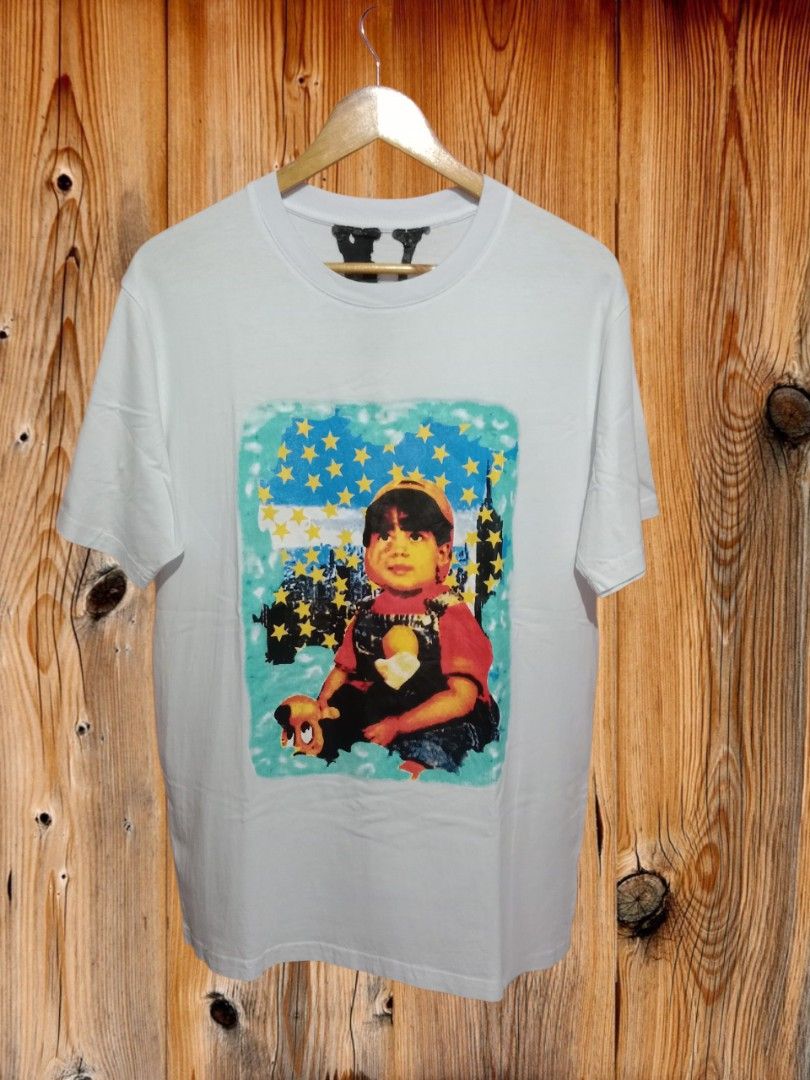 Vlone Yams Day 2020 Tee (Category: Tshirts & Polo Shirts ) located in Davao. Submitted by ayeeasyshop13 (Listing ID 1463279913, Image 2). Description: This is a white VLONE Yams Day 2020 Tee featuring a graphic print of a young child surrounded by yellow stars on the front (EXTREMELY RARE) As new condition Size Large on tag Dimension 21/29 1500 + SF.