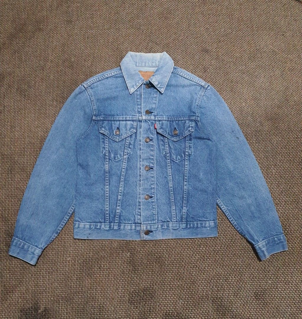 Vintage Levi's Denim Trucker Jacket (Category: Coats, Jackets and Outerwear) located in Baguio. Submitted by drew1404 (Listing ID 1463254728, Image 1). Description: Item Details: ◦​Model: 70505-0213 ◦​Era: 1970s (1972–1977 production era) ◦​Origin: Made in U.S.A. ◦​Patch: Original Jacron paper patch intact and fully legible (70505 0213 / 38 SIZE) ◦​Tab: Small "e" red tab on the chest pocket ◦​Buttons: Single-dash factory stamp on the back ◦​Condi