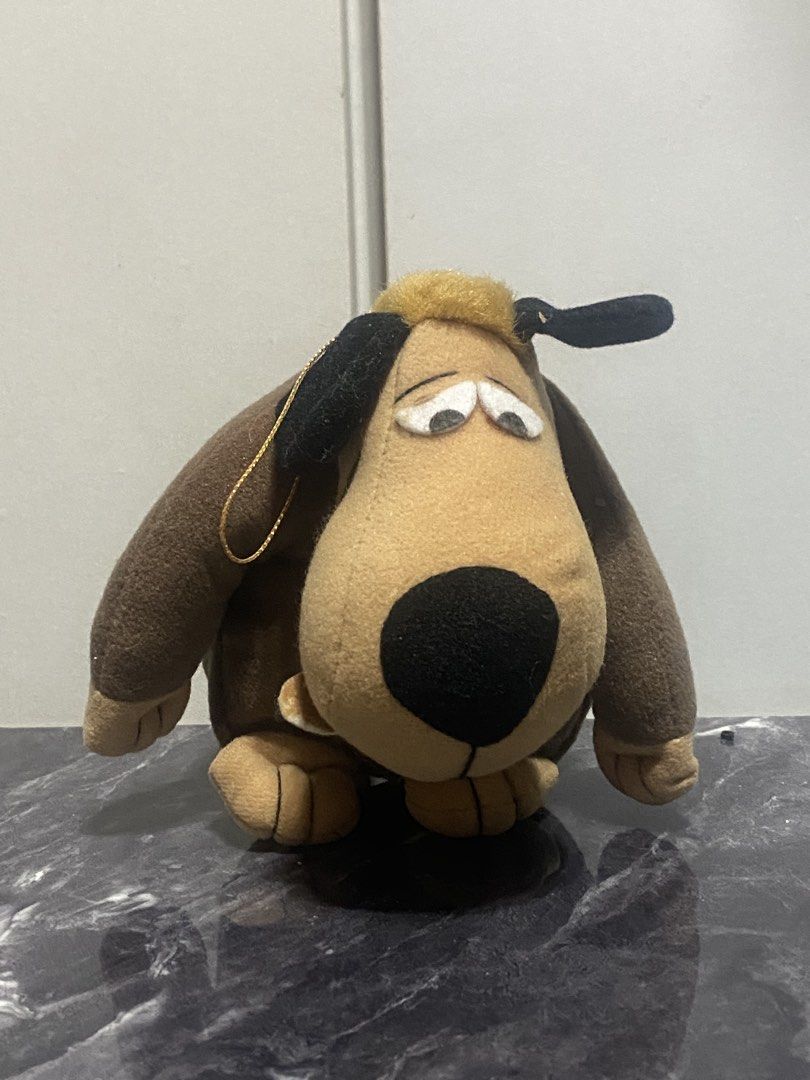 Wacky Races Plush Dog Toy (Category: Plushies & Soft Toys) located in Manila. Submitted by kuya_moto (Listing ID 1463247149, Image 1). Description: - Adorable plush toy from the classic cartoon Wacky Races. - Features the iconic brown dog character. - Soft and squishy material, perfect for cuddling. - Includes a small loop at the top, ideal for hanging or display. - A must-have collectible for fans of Wacky Races!.