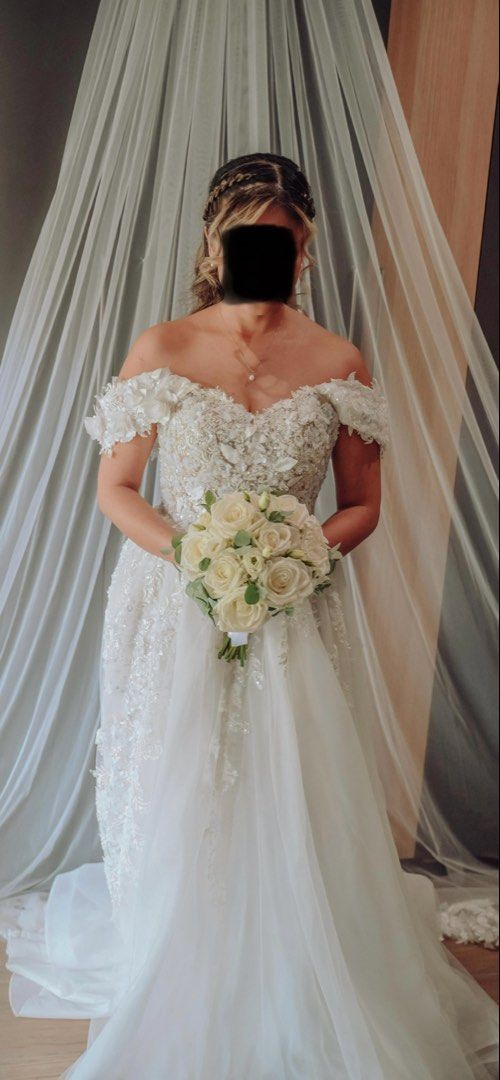 Wedding gown (Category: Evening dresses & gowns) located in Cebu City. Submitted by prelovedbymecebu (Listing ID 1463322276, Image 1). Description: Made by Yoko Sato Cebu Custom off-shoulder wedding gown featuring a sweetheart neckline, exquisite 3D floral appliqués and intricate beadwork across the bodice, and a graceful layered tulle skirt. Measurements: Please check photo Not yet dry cleaned used only for 9hours Selling for 20k Negotiable Loc 