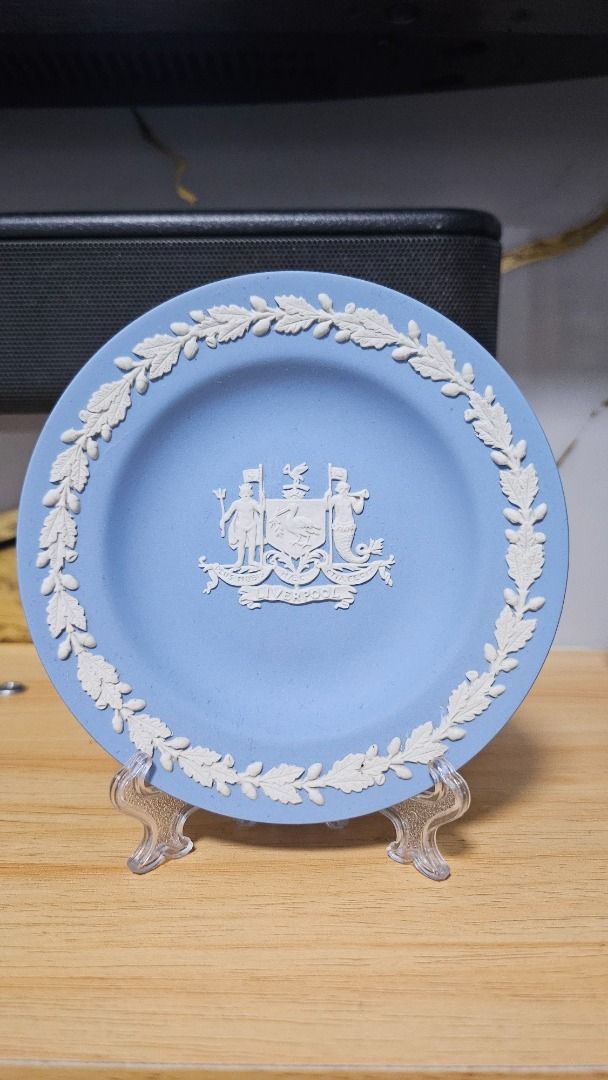 Wedgwood Blue Jasperware Plate with Crest (Category: Vases & Decorative Bowls) located in Manila. Submitted by auybiag (Listing ID 1463203402, Image 1). Description: - Authentic Wedgwood Jasperware plate - Stunning blue color - Features a white bas-relief crest - Surrounded by a laurel wreath border - Approximately 6 inches in diameter - Ideal for home decor, display, or as a collectible.