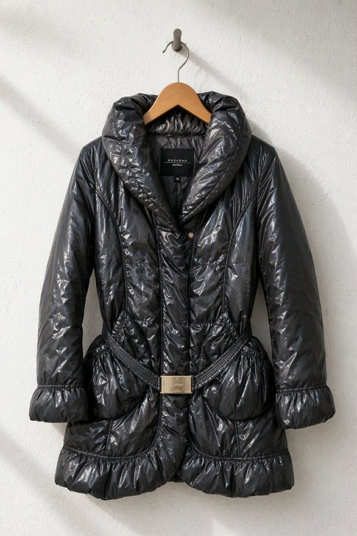 Weekend MaxMara puffer coat (Category: Coats, Jackets and Outerwear) located in Baguio. Submitted by luxeloom099 (Listing ID 1463195847, Image 2). Description: Weekend MaxMara Heavy Padded Jacket ​Stay warm in style with this chic, high-sheen Weekend MaxMara padded jacket. Featuring heavy insulation, a plush shawl collar, feminine ruffled trim at the cuffs and hem, and a cinch-waist belt with a metallic buckle lightweight to wear, but heavily pad