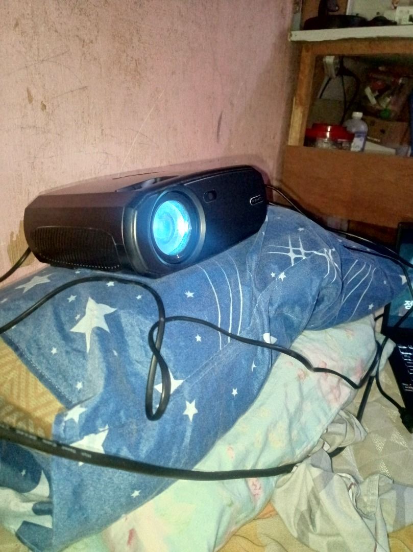 WeWatch Projector with Cables (Category: Projectors) located in Manila. Submitted by dxnnatello (Listing ID 1463184459, Image 2). Description: - WeWatch Projector V50 - Projects a clear image (230 Ansi lumens) - Works well, never pa napaayos - Comes with all necessary cables ( cord and free 1M HDMI ) - Ideal for movie nights and presentations (gamit na gamit din if you're a teacher) - Compact and portable design. - Clear audio - can use to cast y
