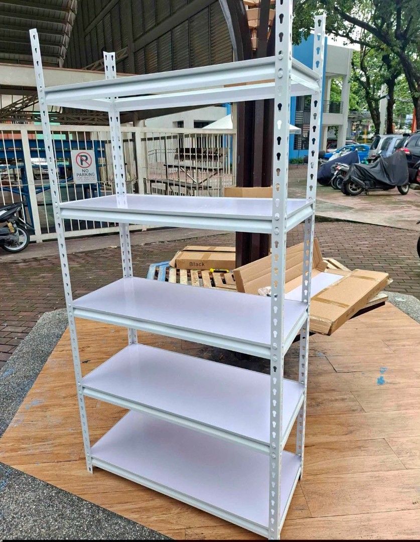 White 5-Tier Metal Shelving Unit (Category: Shelves, Cabinets & Racks) located in Caloocan City. Submitted by swiftflower_802790 (Listing ID 1463158041, Image 1). Description: - White 5-tier metal shelving unit - Ideal for home or garage storage - Easy to assemble - Adjustable shelves - Dimensions: Approx. 180cm (H) x 90cm (W) x 45cm (D) - Pick up only.