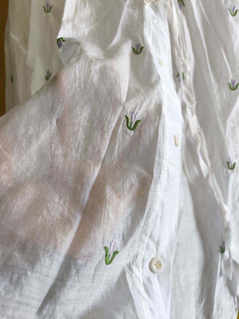 White Blouse with Floral Detail (Category: Blouses) located in Taguig. Submitted by deyerreC2020 (Listing ID 1463164948, Image 3). Description: sale! Sheer white blouse with floral embroidery. Features tie-neck, quality polyester fabric like new condition button-up front, and long sleeves. Perfect for layering for summer spacious comfy XL MOP: Gcash/Maya/cash .