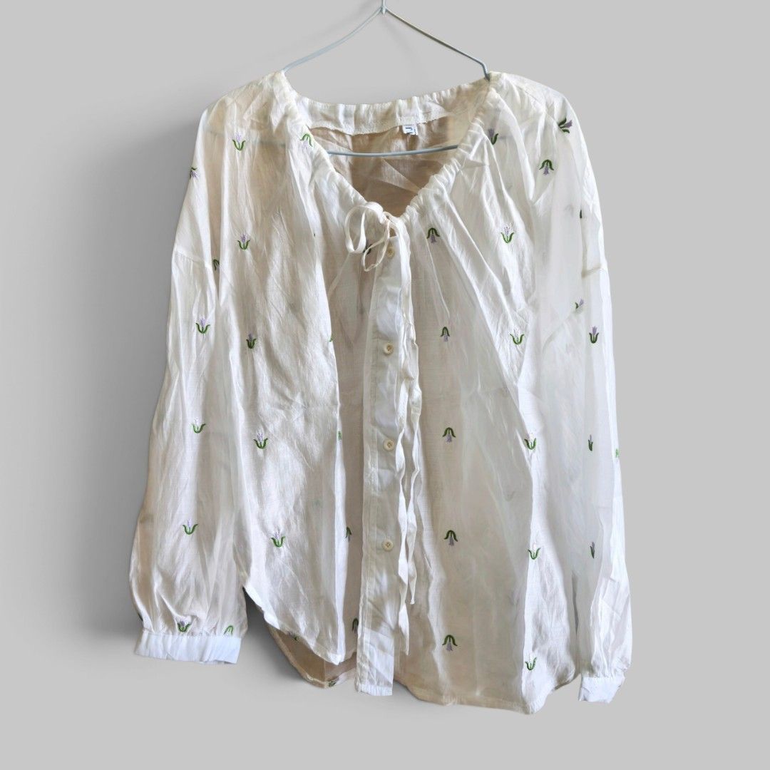 White Blouse with Floral Detail (Category: Blouses) located in Taguig. Submitted by deyerreC2020 (Listing ID 1463164948, Image 1). Description: sale! Sheer white blouse with floral embroidery. Features tie-neck, quality polyester fabric like new condition button-up front, and long sleeves. Perfect for layering for summer spacious comfy XL MOP: Gcash/Maya/cash .