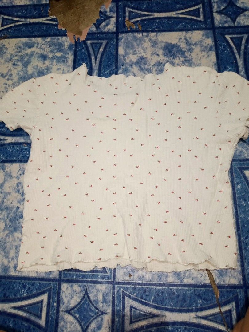 White Cropped T-shirt with Red Cherry Print (Category: Blouses) located in Manila. Submitted by aeshieballl (Listing ID 1463239209, Image 2). Description: - Adorable white cropped t-shirt - Features a fun all-over red cherry print - Trendy ribbed texture - Cute lettuce hem on sleeves and bottom edge - Estimated size: Small to Medium - Ideal for everyday casual wear.