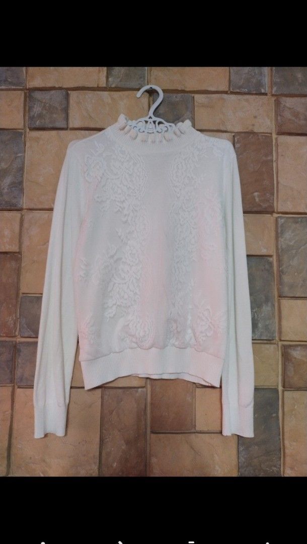 White Lace Mock Neck Long Sleeve Sweater (Category: Longsleeves) located in Manila. Submitted by misrezuri (Listing ID 1463148507, Image 1). Description: - Chic white sweater - Features intricate lace detailing on the front - Stylish ruffled mock neck - Comfortable long sleeves with ribbed cuffs - Soft and cozy knit fabric - Versatile for dressing up or down.