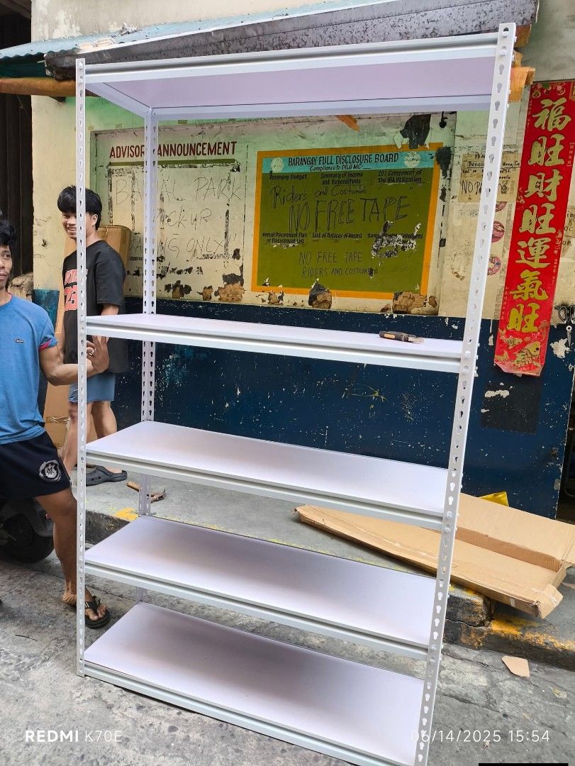 White Metal 5-Tier Shelving Unit (Category: Shelves, Cabinets & Racks) located in Caloocan City. Submitted by swiftflower_802790 (Listing ID 1463158249, Image 1). Description: - Sturdy 5-tier white metal shelving unit - Ideal for home or garage storage - Easy to assemble - Adjustable shelves - Ready for pickup.