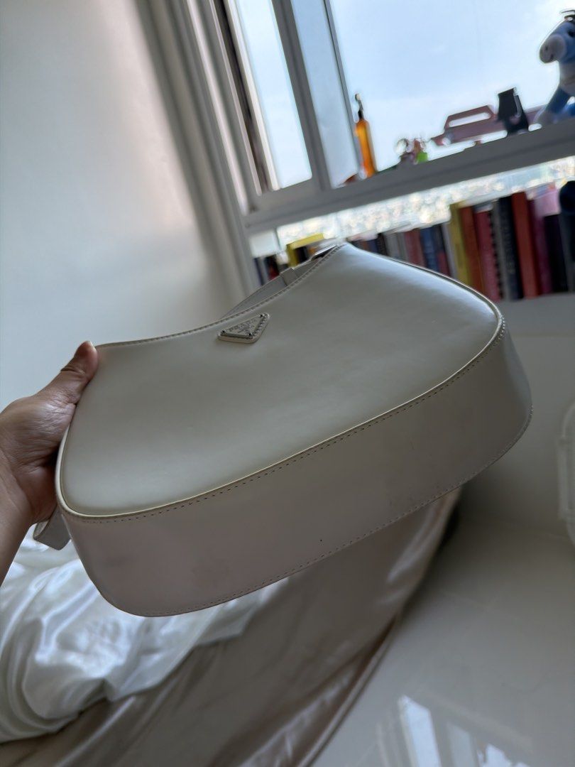 White Prada Shoulder Bag (Category: Luxury Bags & Wallets) located in Cavite. Submitted by thingsidontuse (Listing ID 1463195865, Image 3). Description: - white Prada shoulder bag - Features a silver Prada logo - Adjustable strap for comfortable wear - Interior is clean - Selling because it's no longer in use.
