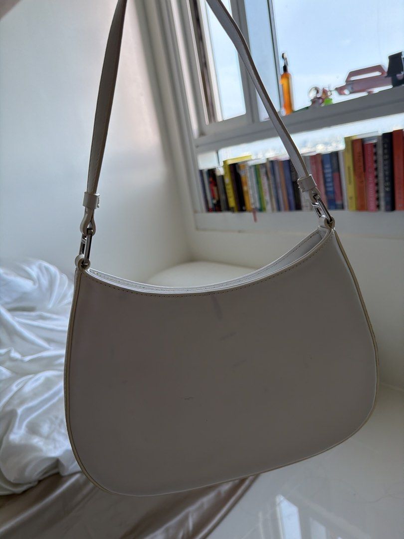 White Prada Shoulder Bag (Category: Luxury Bags & Wallets) located in Cavite. Submitted by thingsidontuse (Listing ID 1463195865, Image 2). Description: - white Prada shoulder bag - Features a silver Prada logo - Adjustable strap for comfortable wear - Interior is clean - Selling because it's no longer in use.
