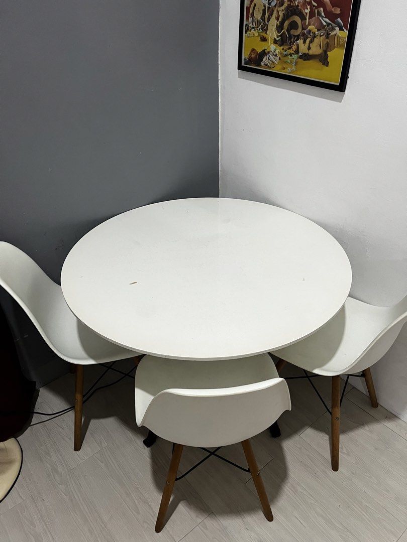 White Round Dining Table with 4 Chairs (Category: Tables & Sets) located in Cavite. Submitted by kulota.store (Listing ID 1463288981, Image 1). Description: White round dining table with 3 modern chairs. Matte finish, wooden legs. Perfect for small spaces. Note: Last price na yan.