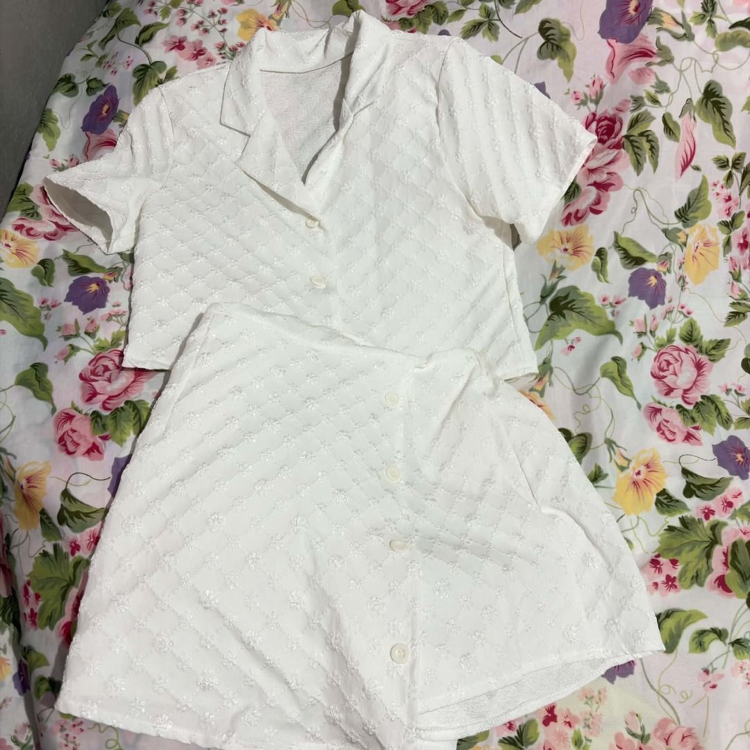 White Textured Set - Short Sleeve Top & Skort (Category: Sets or Coordinates) located in Santa Rita. Submitted by john_valencia02 (Listing ID 1463219065, Image 1). Description: - Cute white set - Textured fabric all over - Short sleeve collared top with buttons - Matching skort with buttons - Comfortable and stylish .