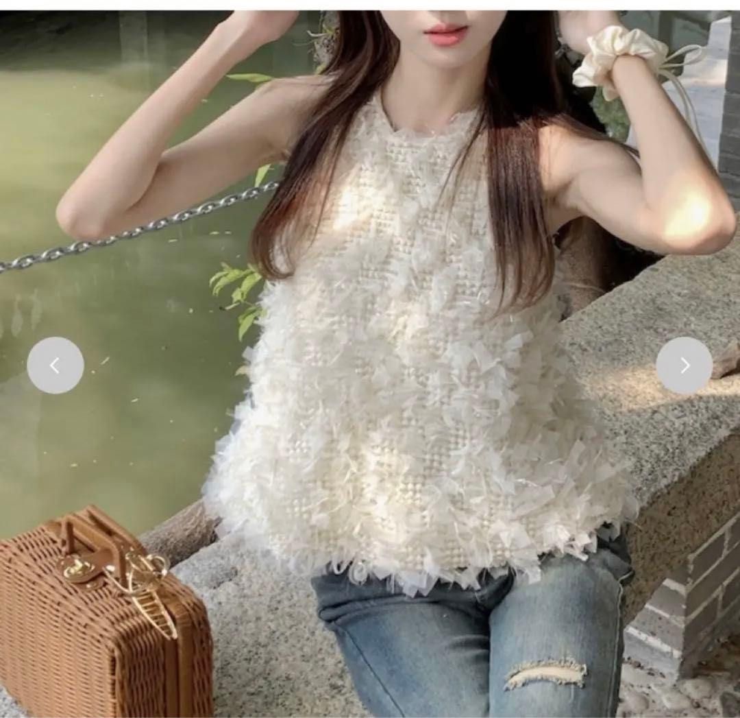 White Textured Sleeveless Halter Neck Top (Category: Sleeveless) located in Manila. Submitted by prettyme31 (Listing ID 1463322382, Image 3). Description: - White sleeveless top - Unique textured/fringe-like overlay - Halter neck style - Zip closure at the back - Versatile: dress up or down - Perfect for summer evenings or a night out.