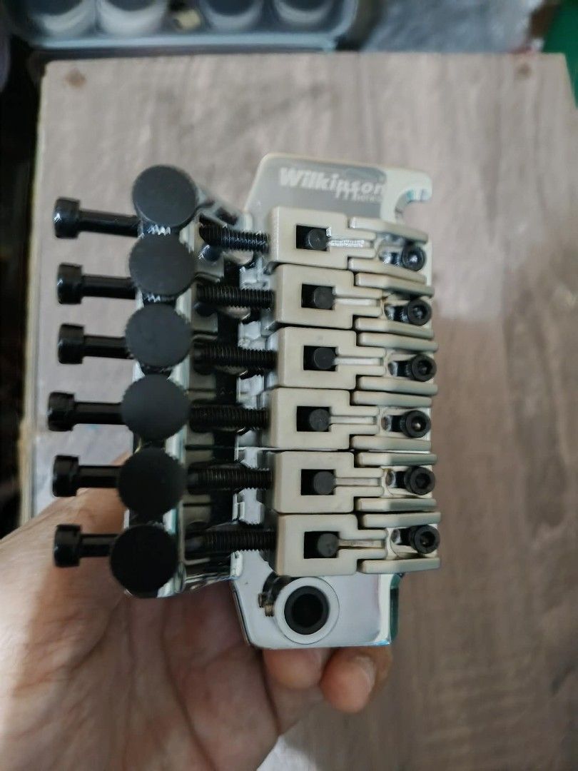 Wilkinson Series Tremolo Bridge with Accessories (Category: Musical Instruments) located in Manila. Submitted by the_simple_things (Listing ID 1463267133, Image 2). Description: - Wilkinson Series Tremolo Bridge -Almost Brand New -Excellent Condition - Wilkinson WODL1 Floating Bridge Floyd Rose Double Locking Locking nut stainless finish w/ 1 stainless tremolo arm and 1 extra black tremolo arm. - Ideal for Guitar Upgrades or Repairs - All parts s