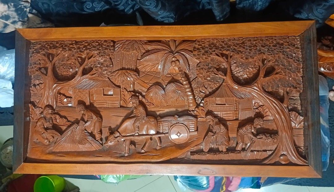 Wood Carved (Category: Wall Decor) located in Mandaluyong City. Submitted by theforgottentreasures (Listing ID 1463250603, Image 3). Description: 12k pesos! 📌 Hand-carved Wooden traditional rural Philippine harvest 32 x 16 x 2 ¾ inches heavy solid wood High-relief wood carving often integrated into vintage centerpieces, coffee table tops, or wall-mounted murals what you see is what you get.