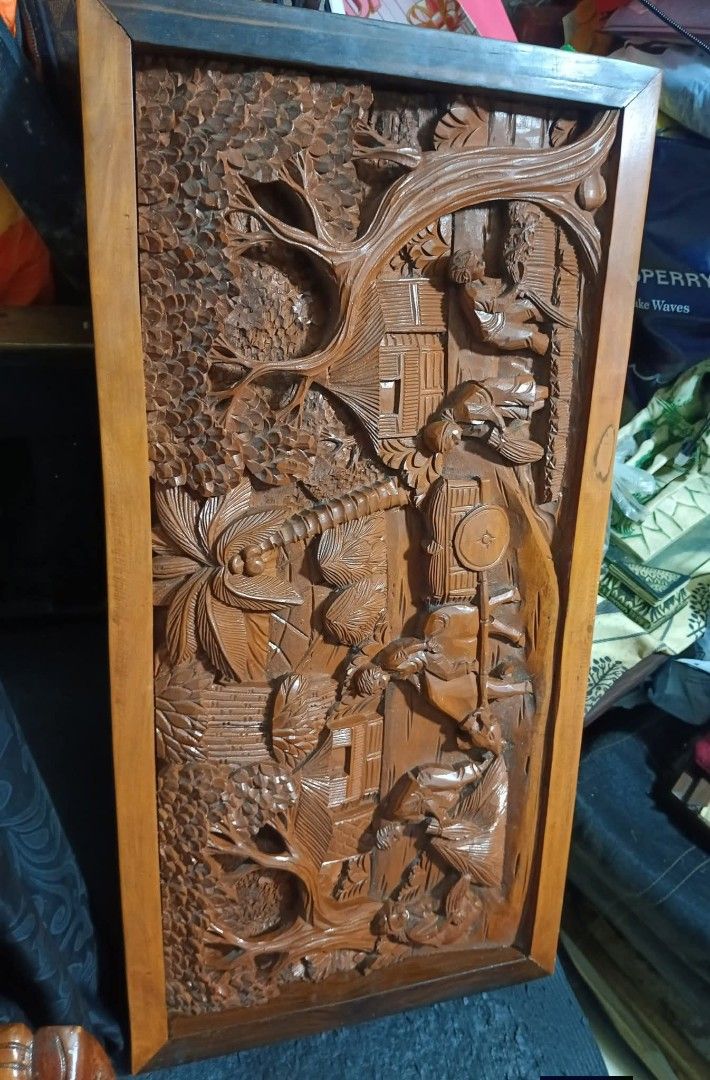 Wood Carved (Category: Wall Decor) located in Mandaluyong City. Submitted by theforgottentreasures (Listing ID 1463250603, Image 2). Description: 12k pesos! 📌 Hand-carved Wooden traditional rural Philippine harvest 32 x 16 x 2 ¾ inches heavy solid wood High-relief wood carving often integrated into vintage centerpieces, coffee table tops, or wall-mounted murals what you see is what you get.