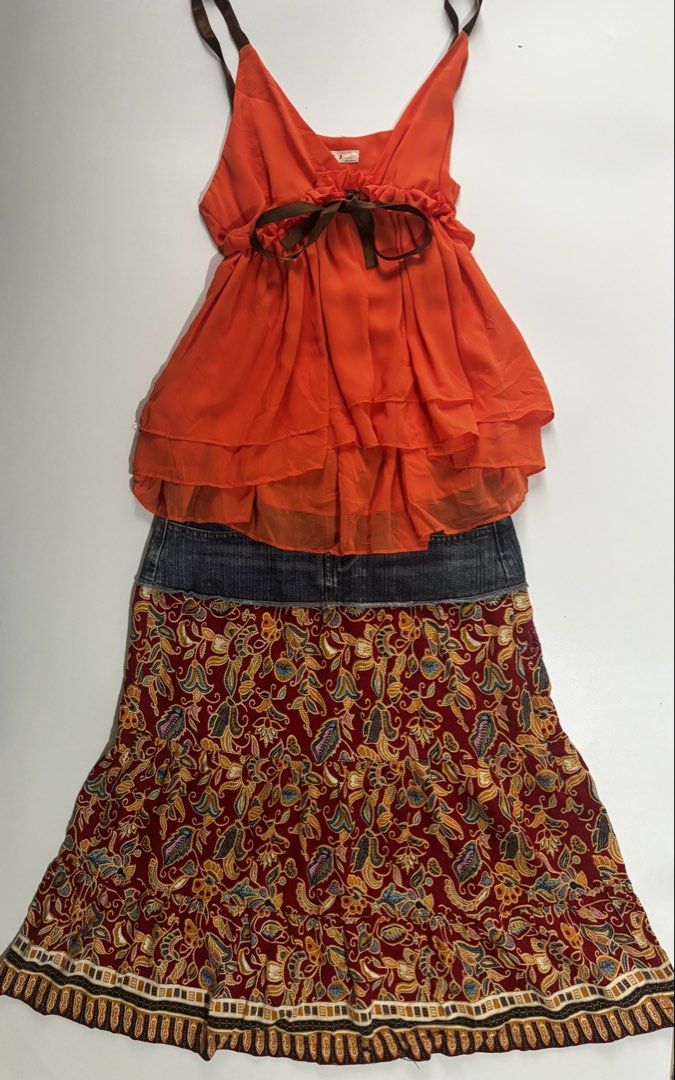 Y2K Orange Ruffle Cami + Paisley Patchwork Skirt Set (Category: Sets or Coordinates) located in Manila. Submitted by manicpixiefinds (Listing ID 1463215851, Image 1). Description: the cutest statement set 🧡✨ featuring a vibrant orange ruffle cami with a sweet brown ribbon tie detail paired with a vintage-inspired paisley patchwork maxi skirt. reyna ng quezon city vibe ♡ flowy + feminine silhouette ♡ layered ruffle cami with ribbon bow ♡ denim-st